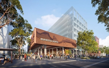 Exterior view of Burwood North metro station entrance with pedestrians and street frontage
