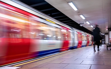Blurred shot of a moving train, capturing the dynamic motion of the rail