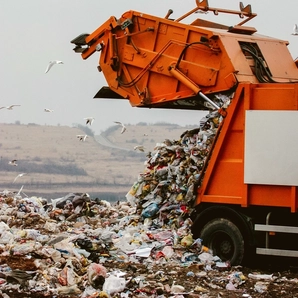 Garbage truck dumping the garbage on a landfill