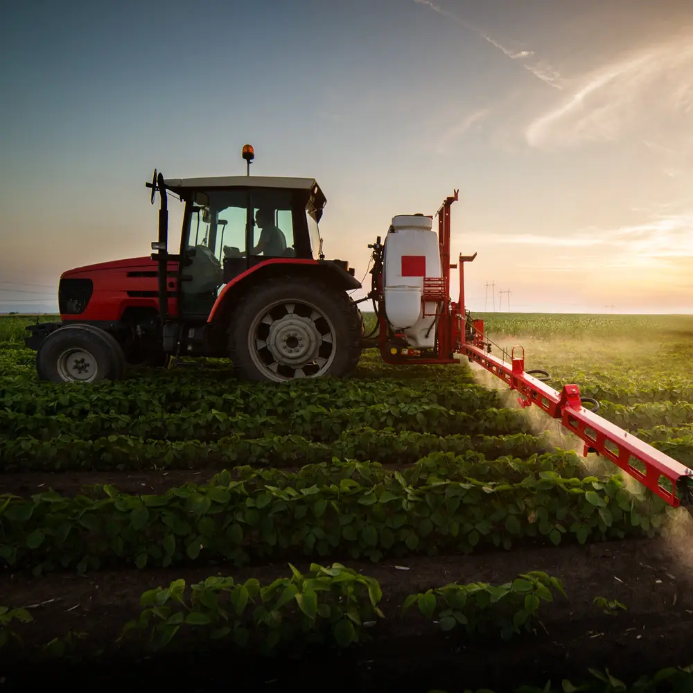 tractor spraying soy field 