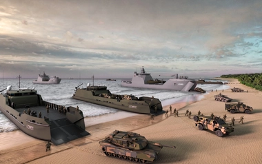 Landing craft and military vehicles conducting a beach landing operation.