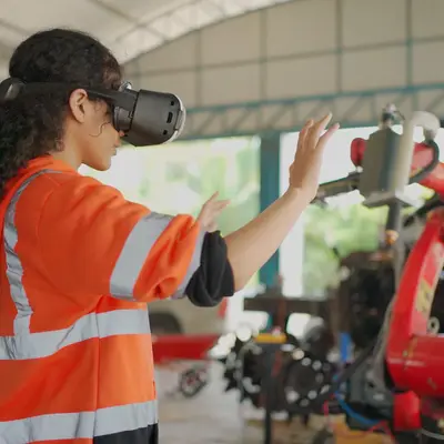 an engineer controls a machine using VR technology