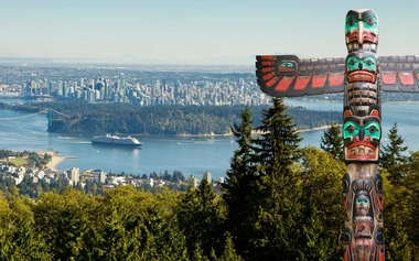 Tiki pillar with panoramic view of Western Canada